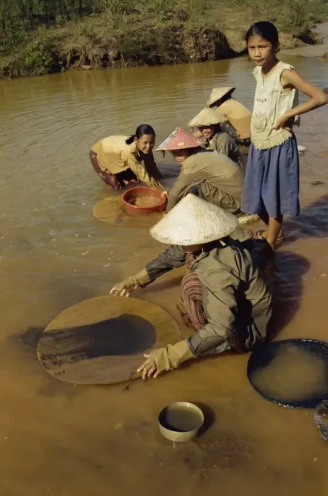 Framed Print : Women panning for black tin oxide