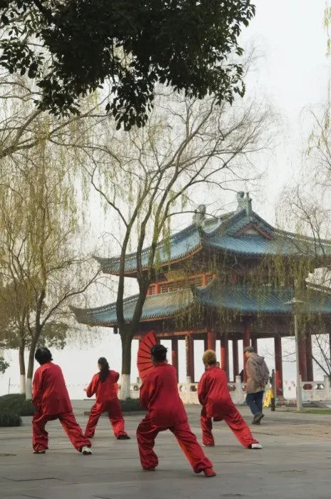 Framed Print : Women practising tai chi in front of a pavilion on West Lake, Hangzhou Framed Print : Women practising tai chi in front of a pavilion on West Lake, Hangzhou