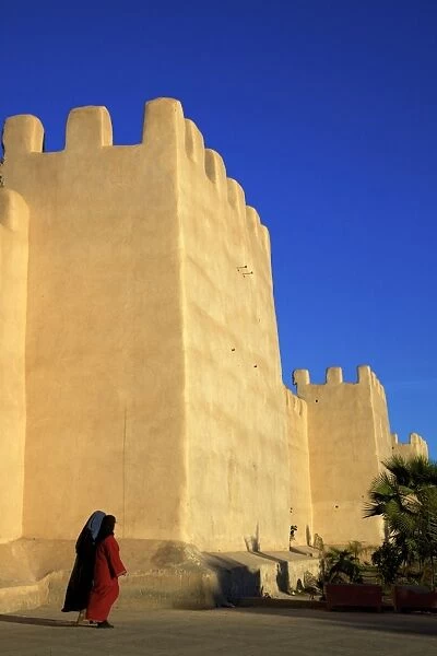 Women in traditional dress with Old City wall, Taroudant, Morocco, North Africa, Africa