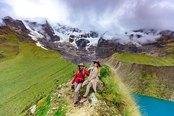 Two women trekking Humantay Lake, Cusco, Peru, South America