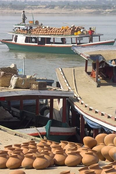 Wooden boats transporting pottery on the Ayeryarwady (Irrawaddy) River