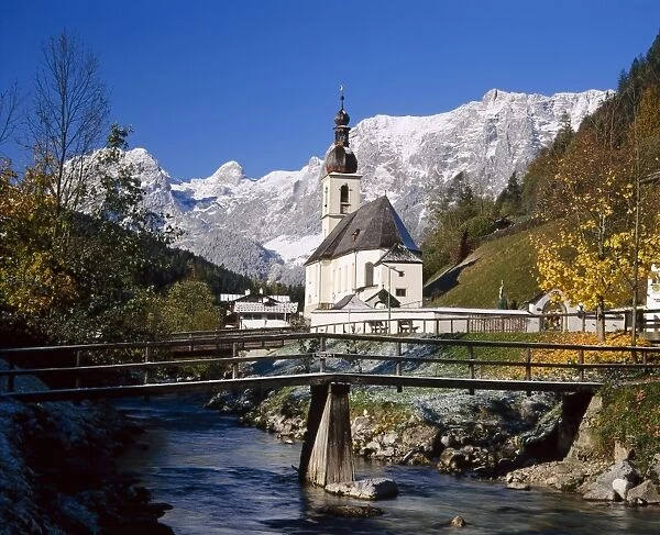 Wooden bridge in front of the church at Ramsau in the
