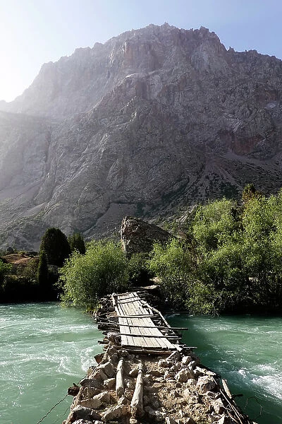 Wooden bridge over a river in the remote and spectacular Fann Mountains, part of the western Pamir-Alay, Tajikistan, Central Asia, Asia