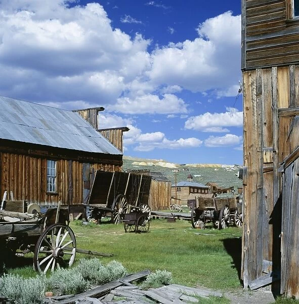 Wooden buildings and carts at Bodie
