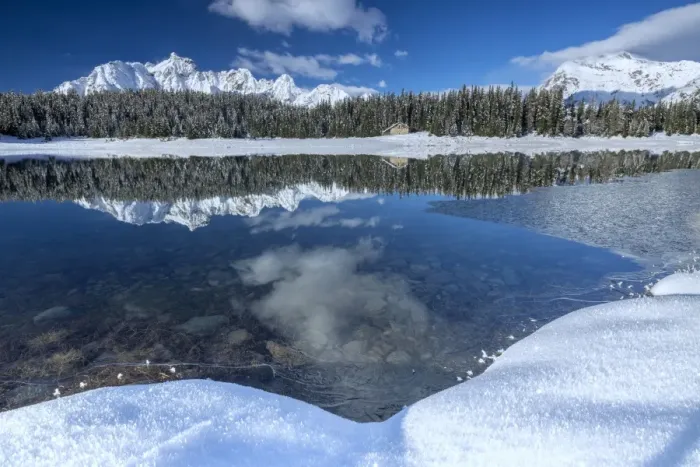Framed Print : Wooden chalet surrounded by snowy peaks and woods reflected in Lake Palu, Malenco Valley Framed Print : Wooden chalet surrounded by snowy peaks and woods reflected in Lake Palu, Malenco Valley
