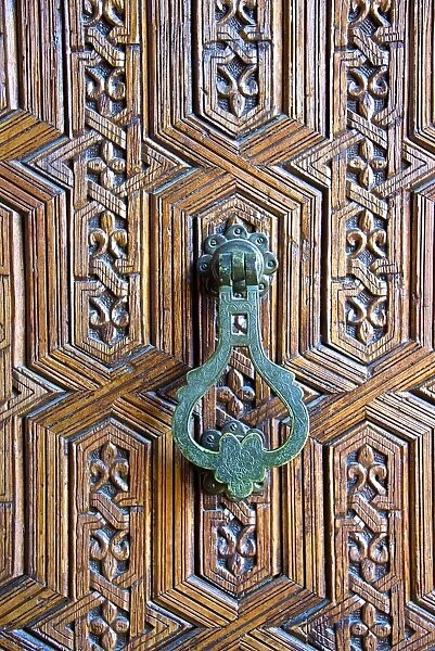 Detail of a wooden door and bronze knocker, Islamo-Andalucian art, Marrakech Museum, Marrakech, Morocco, North Africa, Africa