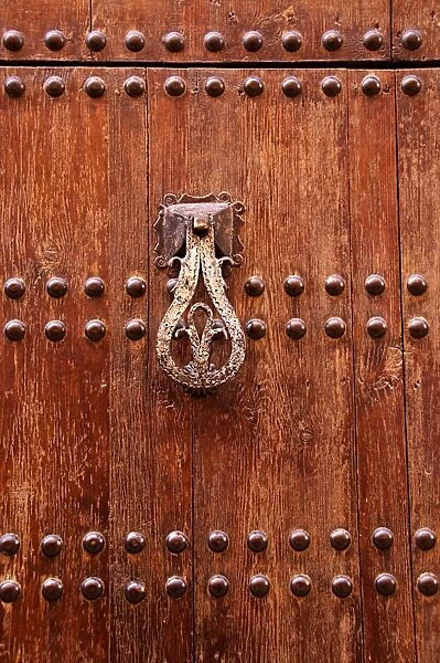 Detail of a wooden door and bronze knocker, Islamo-Andalucian art, Marrakech Museum, Marrakech, Morocco, North Africa, Africa