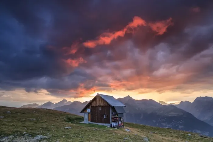Framed Print : Wooden hut framed by fiery sky and clouds at sunset, Muottas Muragl, St