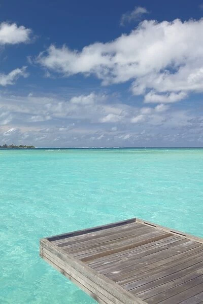 Wooden jetty and tropical sea, view from island, Maldives, Indian Ocean, Asia