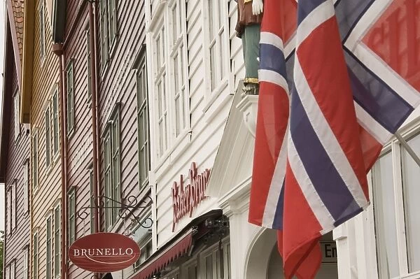 Wooden merchants premises and Norwegian flag, Bryggen old harbour side