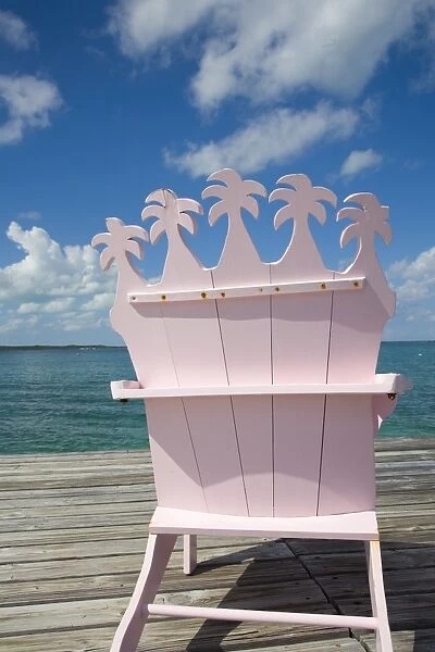 Wooden pink beach chairs in shape of palm trees