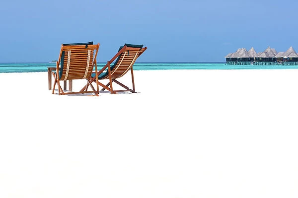 Wooden sun loungers on beach, Coco Palm, Dhuni Kolhu, Baa Atoll, Republic of Maldives
