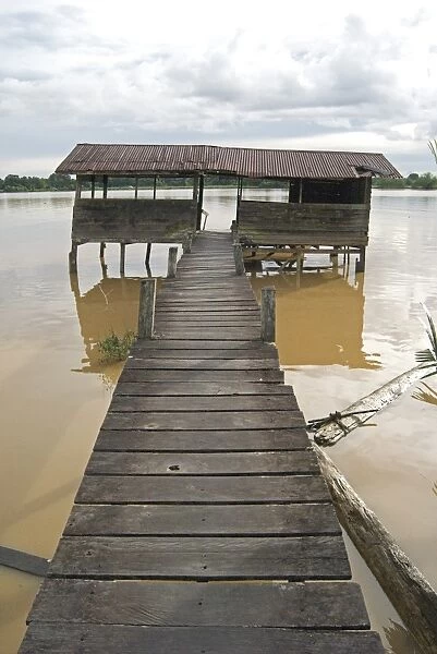 Wooden walkway from longhouse to river ferry point, Sarawak River, Sarawak