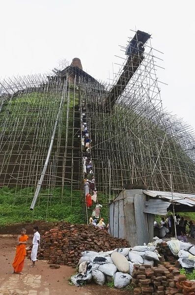 Workers and scaffolding on the Abhayagiri Dagoba, Anuradhapura, UNESCO World Heritage Site, Sri Lanka, Asia