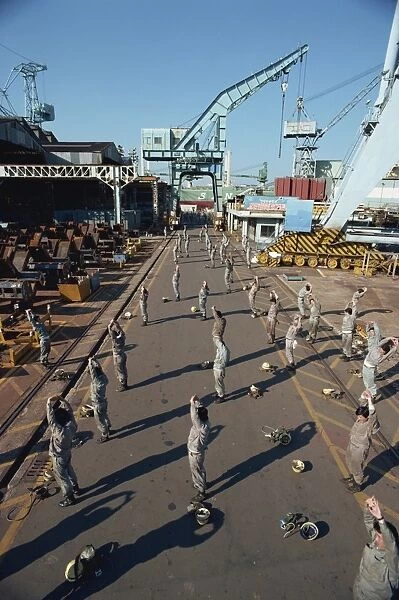 Workers stretching and exercising before work in the morning