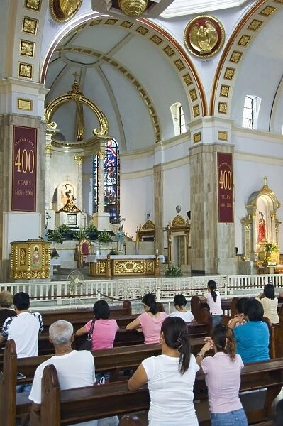Worshippers in Church of the Black Nazarene