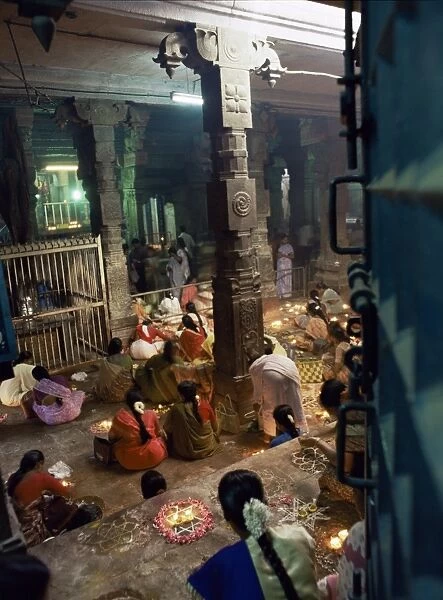 Worshippers at a shrine inside the Sri Meenakshi Temple