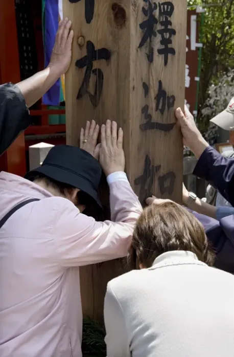Framed Print : Worshippers touching a wooden obelisk for inspiration at a sub temple of Zenkoji Temple Framed Print : Worshippers touching a wooden obelisk for inspiration at a sub temple of Zenkoji Temple