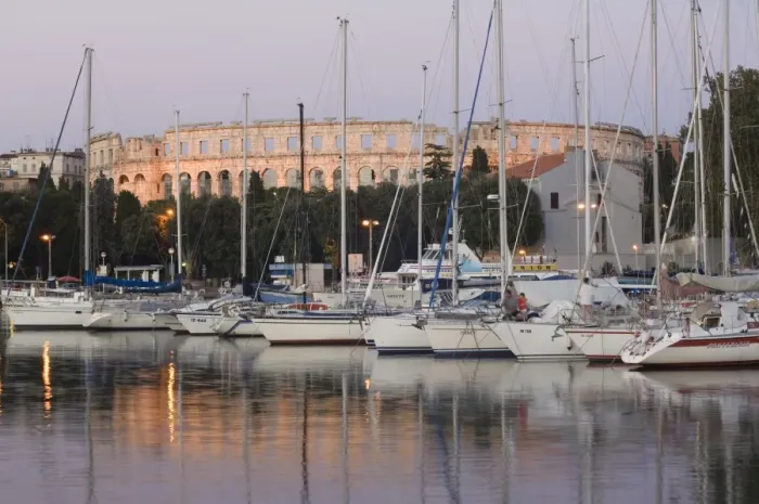 Framed Print : Yachts in the harbour, with the 1st century Roman amphitheatre beyond in evening light Framed Print : Yachts in the harbour, with the 1st century Roman amphitheatre beyond in evening light