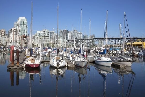 Yachts moored in False Creek at Granville Island with Granville Bridge
