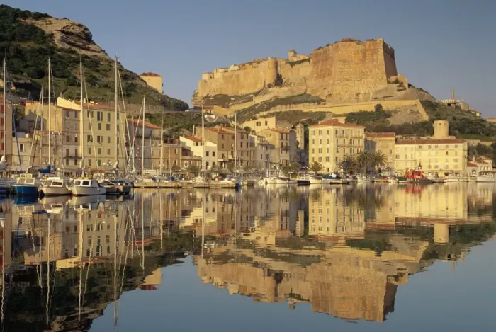 Framed Print : Yachts moored in the harbour, with the citadel behind, Bonifacio, Corsica Framed Print : Yachts moored in the harbour, with the citadel behind, Bonifacio, Corsica