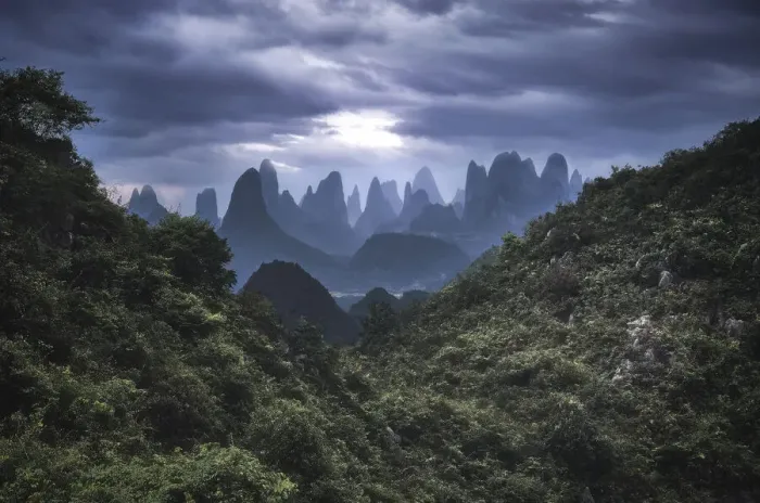 Framed Print : Yangshuo mountains with dark clouds framed by hills, Yangshuo, Guangxi, China, Asia Framed Print : Yangshuo mountains with dark clouds framed by hills, Yangshuo, Guangxi, China, Asia