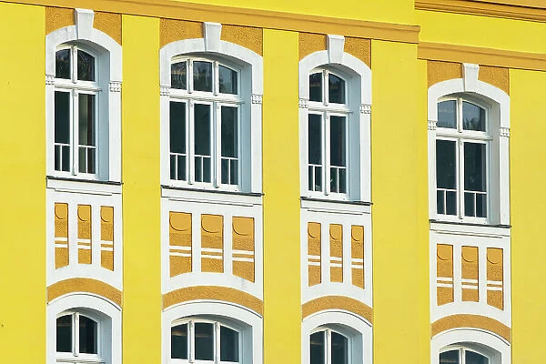Detail of yellow facade of Svaty Florian (St. Florian) family brewery, Loket, Czech Republic (Czechia), Europe