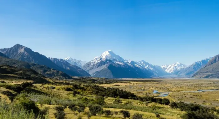 Framed Print : Yellow grass field with large mountains in the distance, South Island, New Zealand