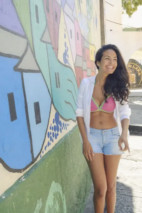 Framed Print : Young Brazilian woman happy and smiling next to a graffiti wall in Lapa, central Rio de Janeiro Framed Print : Young Brazilian woman happy and smiling next to a graffiti wall in Lapa, central Rio de Janeiro