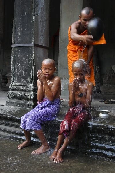 Young Buddhists have their heads shaved as an offering to Buddha, Angkor Wat temple