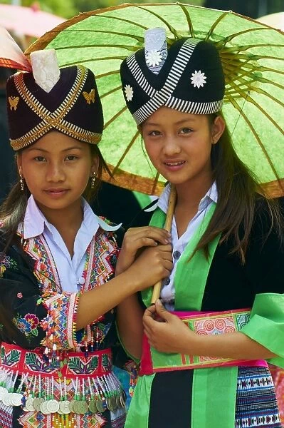 Young Hmong women in traditional dress, Lao New Year festival, Luang Prabang