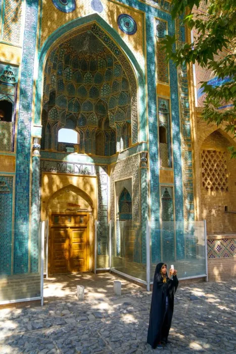 Framed Print : Young Iranian girl in chador taking picture in front of Jameh Mosque, Natanz, Iran Framed Print : Young Iranian girl in chador taking picture in front of Jameh Mosque, Natanz, Iran