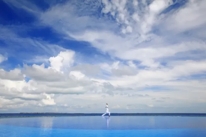 Framed Print : Young man meditating by infinity pool, Maldives, Indian Ocean, Asia Framed Print : Young man meditating by infinity pool, Maldives, Indian Ocean, Asia