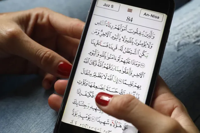 Framed Print : Young Muslim woman reading a digital Quran on a smartphone, Vietnam, Southeast Asia, Asia Framed Print : Young Muslim woman reading a digital Quran on a smartphone, Vietnam, Southeast Asia, Asia