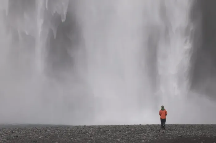Framed Print : Young woman admiring the big waterfall of Skogarfoss, Iceland, Polar Regions Framed Print : Young woman admiring the big waterfall of Skogarfoss, Iceland, Polar Regions