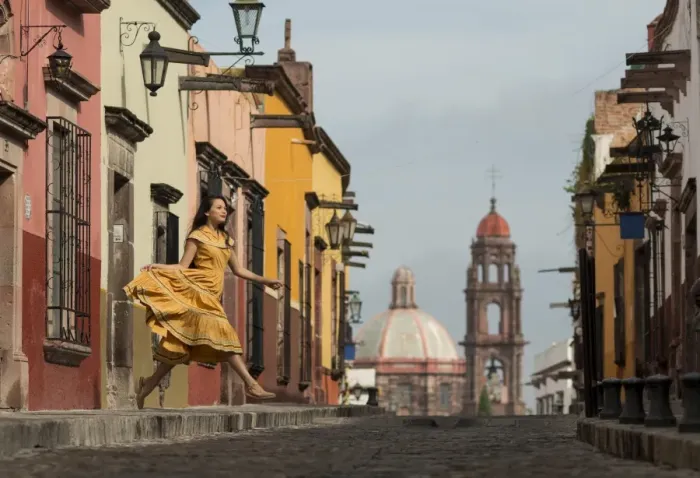 Framed Print : Young woman dancing down cobbled street (recreo), San Miguel de Allende, Guanajuato, Mexico, North America Framed Print : Young woman dancing down cobbled street (recreo), San Miguel de Allende, Guanajuato, Mexico, North America