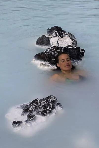 Young woman enjoying bathing in hot spring, Blue Lagoon, Iceland, Polar Regions