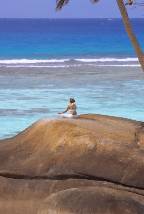 Framed Print : Young woman meditating on rock, Seychelles, Indian Ocean, Africa Framed Print : Young woman meditating on rock, Seychelles, Indian Ocean, Africa