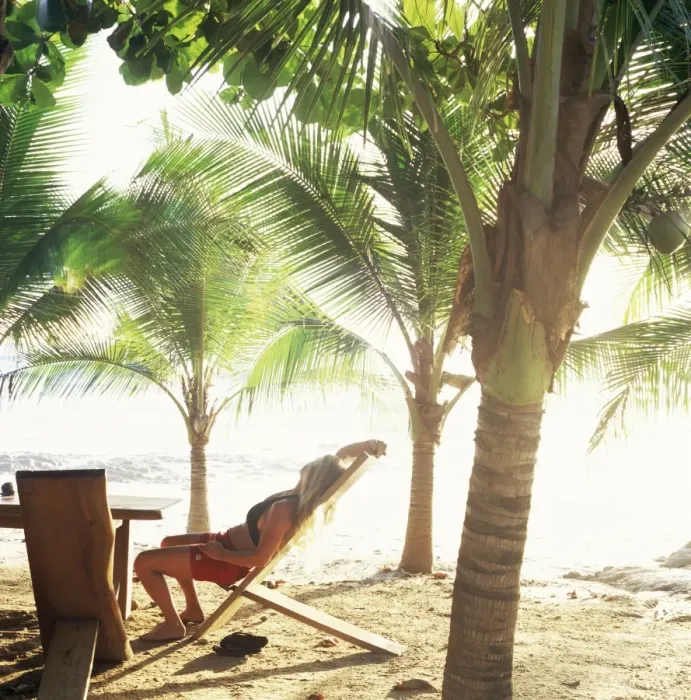 Framed Print : Young woman relaxes on Avellans Beach, Costa Rica, Central America Framed Print : Young woman relaxes on Avellans Beach, Costa Rica, Central America