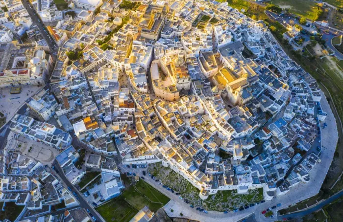 Framed Print : Zenithal aerial view of the old town of Ostuni at sunset, Apulia, Italy, Europe Framed Print : Zenithal aerial view of the old town of Ostuni at sunset, Apulia, Italy, Europe