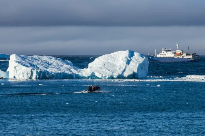Framed Print : Zodiac cruising back to a cruise ship anchoring behind an iceberg, Brown Bluff, Antarctica Framed Print : Zodiac cruising back to a cruise ship anchoring behind an iceberg, Brown Bluff, Antarctica