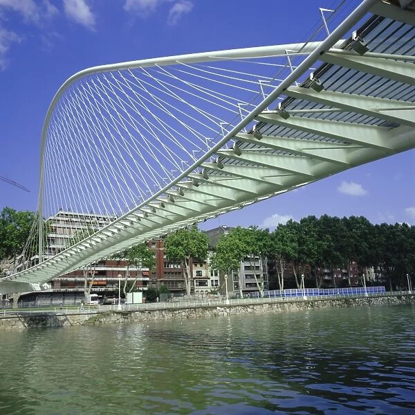 Zubizuri curved pedestrian bridge over Bilbao River