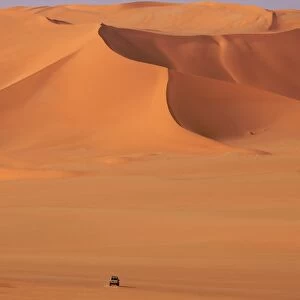A 4x4 vehicle on the dunes of the erg of Murzuk in the Fezzan desert, Libya