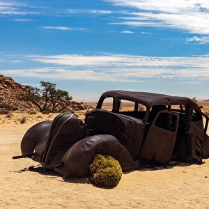 An Abandoned car that was shot down in a Diamond Heist in 1934 within Aus Vista, Namibia