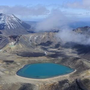 Aerial of a blue lake with Mount Ngauruhoe in the background, Tongariro National Park, UNESCO World Heritage Site, North Island, New Zealand, Pacific