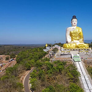 Aerial of a giant sitting Buddha below the Kyaiktiyo Pagoda (Golden Rock), Mon state