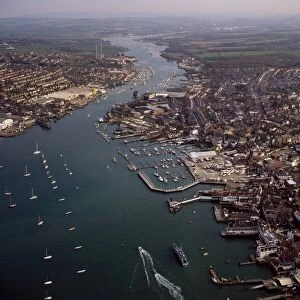 Aerial image of Cowes, on the west bank of the estuary of the River Medina facing the smaller town of East Cowes on the east bank, Isle of Wight. England, United