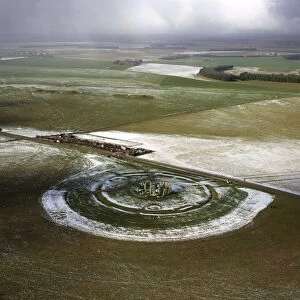 Aerial image of Stonehenge, prehistoric monument and stone circle in snow