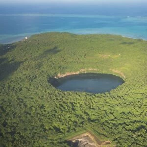 Aerial of Lalolalo lake volcanic crater lake, center of Wallis, Wallis and Futuna