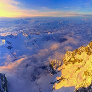 Aerial panoramic of Grandes Jorasses, Petites Jorasses and Mont Blanc at sunrise